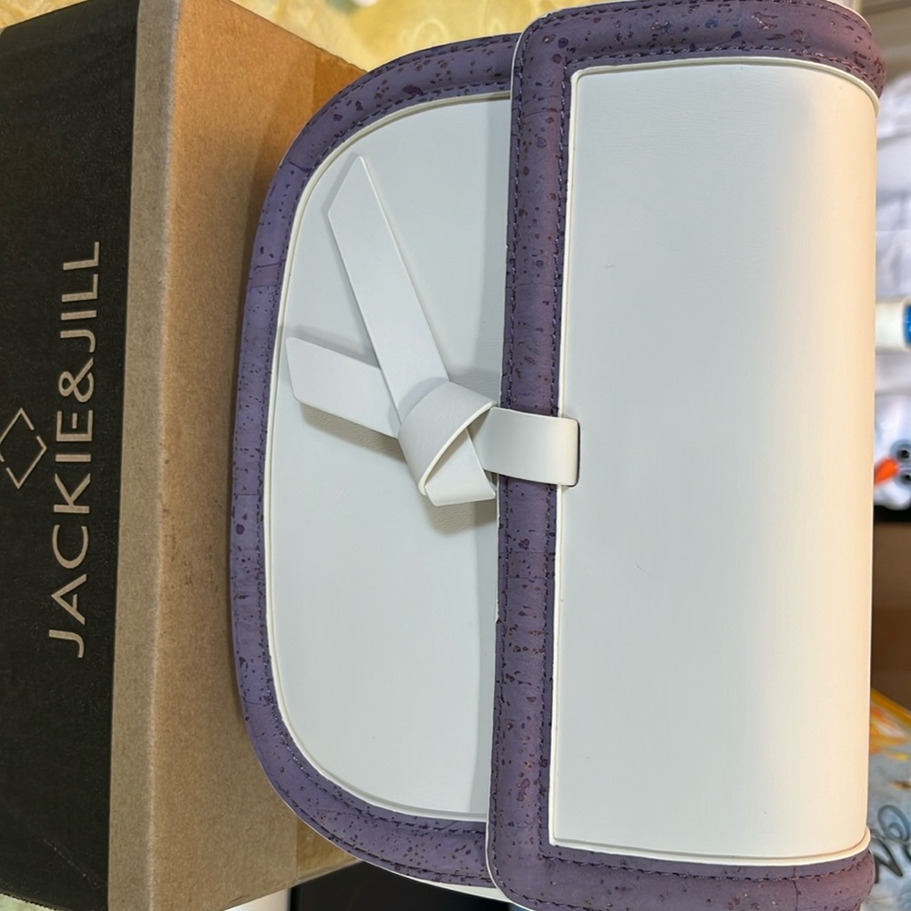 Jackie and Jill egg shell and purple cross bag small purse and straps. NWT.